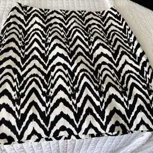 Classic strait black and white skirt on whimsical pattern